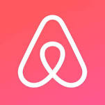 White Airbnb logo, a triangle shape on a pink background