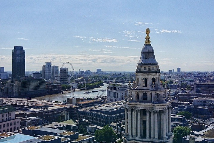 a large clock tower towering over a city