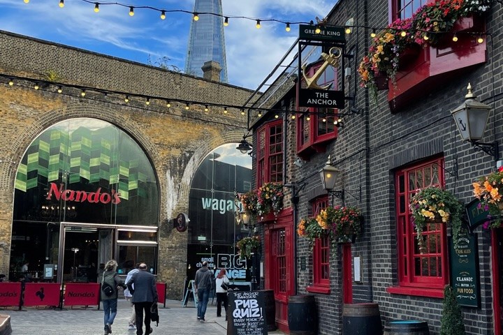a group of people on a sidewalk