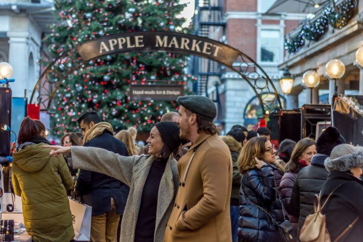 a group of people walking down a street