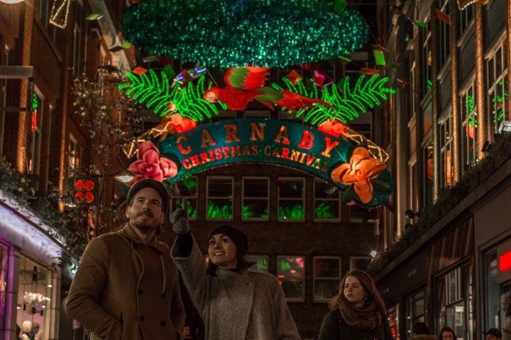 a group of people standing in front of a store