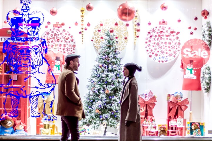 a group of people standing in front of a mirror posing for the camera
