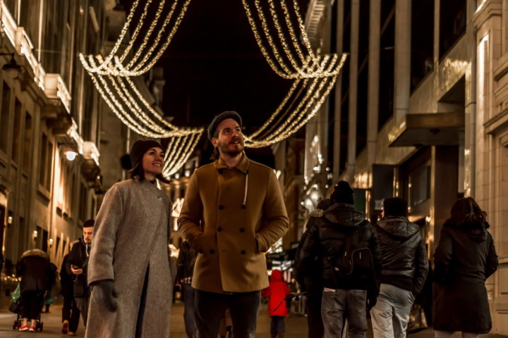 a group of people standing in front of a building